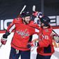 Washington Capitals right wing Tom Wilson (43) celebrates his second goal of the game with center Nicklas Backstrom (19) in the second period of an NHL hockey game against the New York Rangers, Sunday, March 28, 2021, in Washington. (AP Photo/Nick Wass)