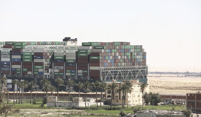 Ever Given, a Panama-flagged cargo ship blocks the Suez Canal almost a week after it got stuck sideways in the crucial waterway, Monday, March 29, 2021. Engineers on Monday &quot;partially refloated&quot; the colossal container ship that continues to block traffic through the Suez Canal, a canal services firm said, without providing further details about when the vessel would be fully set free. (AP Photo/Mohamed Elshahed)