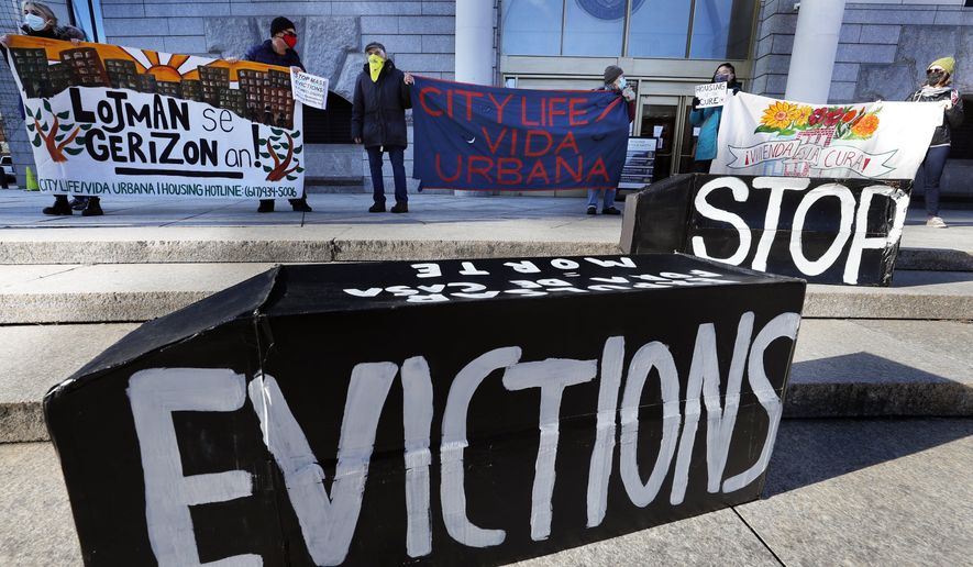 In this Jan. 13, 2021, photo, tenants&#x27; rights advocates demonstrate in front of the Edward W. Brooke Courthouse in Boston. President Joe Biden’s administration is cutting things close on a nationwide eviction moratorium, which is set to expire in less than a week. (AP Photo/Michael Dwyer) **FILE**