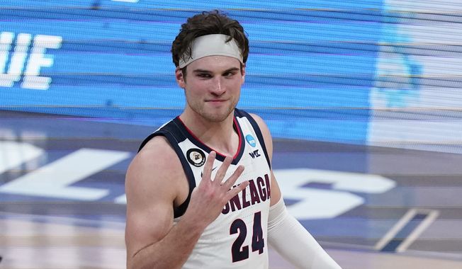 Gonzaga forward Corey Kispert (24) reacts after an Elite 8 game against Southern California in the NCAA men&#x27;s college basketball tournament at Lucas Oil Stadium, Tuesday, March 30, 2021, in Indianapolis. Gonzaga won 85-66. (AP Photo/Michael Conroy)
