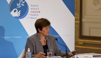 FILE - In this Nov. 12, 2020 file photo, International Monetary Fund Managing Director Kristalina Georgieva attends the Paris Peace Forum at The Elysee Palace in Paris.   Georgieva said Tuesday, March 30, 2021, that when the IMF releases its updated economic forecast next week, it will show the global economy growing at a faster pace than the 5.5% gain it projected at the start of the year.  (Ludovic Marin, Pool via AP)