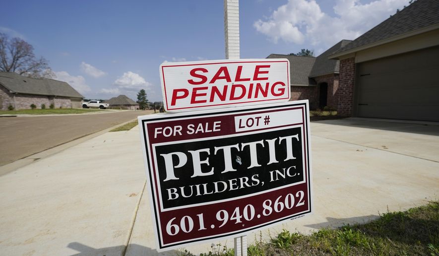 A "Sale Pending" sign stands along side a new driveway in Madison County, Miss., Tuesday, March 16, 2021. U.S. home prices increased at the fastest pace in seven years in January as the pandemic has fueled demand for single-family houses even as the supply for such homes shrinks. The S&P CoreLogic Case-Shiller 20-city home price index, released Tuesday, March 20, rose 11.1% in January from a year earlier. (AP Photo/Rogelio V. Solis)