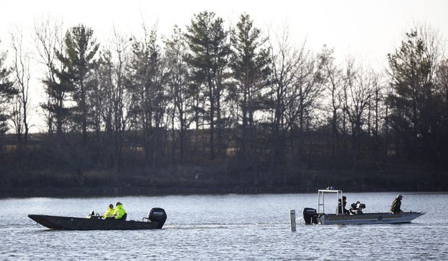 Law enforcement resume the search for a missing Iowa State University Crew Club member on Monday, March 29, 2021, at Little Wall Lake in Hamilton County. The ISU student has been missing since the rescue of three other students and the death of one on the lake Sunday. (Kelsey Kremer/The Des Moines Register via AP)