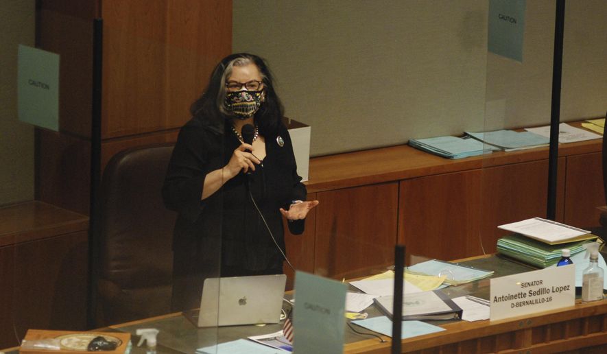 Democratic State Sen. Antoinette Sedillo Lopez of Albuquerque debates on the floor of the New Mexico Senate in Santa Fe, N.M., Friday, March 19, 2021. The New Mexico Legislature was rushing to send final bills to the governor before the end of the annual legislative session at noon on Saturday, March 20, 2021. (AP Photo/Morgan Lee)