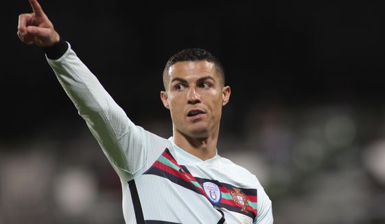 Portugal&#39;s Cristiano Ronaldo reacts during the World Cup 2022 group A qualifying soccer match between Luxembourg and Portugal at the Josy Barthel Stadium in Luxembourg, Tuesday, March 30, 2021. (AP Photo/Olivier Matthys)