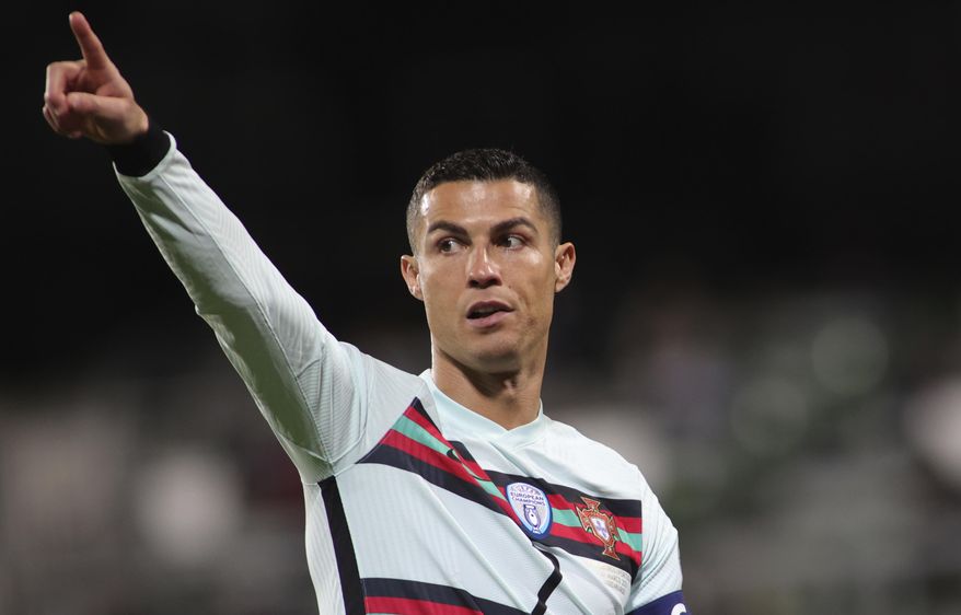 Portugal&#x27;s Cristiano Ronaldo reacts during the World Cup 2022 group A qualifying soccer match between Luxembourg and Portugal at the Josy Barthel Stadium in Luxembourg, Tuesday, March 30, 2021. (AP Photo/Olivier Matthys)