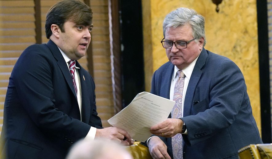 House Judiciary B Committee chairman Nick Bain, R-Corinth, left, confers with House Corrections Committee Chairman Kevin Horan, R-Grenada regarding proposed legislation at the Capitol in Jackson, Miss., Tuesday, March 9, 2021. Lawmakers have a Wednesday deadline for original floor action on general bills and constitutional amendments originating in the other House. (AP Photo/Rogelio V. Solis)