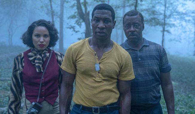 This image released by HBO shows Jurnee Smollett, from left, Jonathan Majors and Courtney B. Vance in a scene from &amp;quot;Lovecraft Country.&amp;quot;  “The Queen’s Gambit,” “Lovecraft Country” and “What We Do in the Shadows” are among the series featured in a virtual edition of the Paley Center’s annual festival. The event celebrates TV programs and their stars and producers. (HBO via AP)