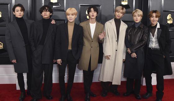 FILE - In this Jan. 26, 2020, file photo, South Korean K-pop band BTS arrives for the 62nd annual Grammy Awards in Los Angeles. BTS released a statement condemning racism against Asians and Asian Americans and Pacific Islanders (AAPI) on Tuesday, March 30, 2021. “We stand against racial discrimination,” the biggest boyband in the world, tweeted to their 34 million followers in both English and Korean.  (Photo by Jordan Strauss/Invision/AP, File)