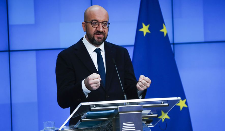 European Council President Charles Michel speaks during an online joint press conference with Director General of the World Health Organization Tedros Adhanom Ghebreyesus at the European Council headquarters in Brussels, Tuesday, March 30, 2021. (AP Photo/Francisco Seco, Pool)