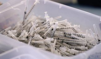 A bin of syringes sits inside a trailer Monday, March 29, 2021, as workers prepare Moderna COVID-19 vaccines at &amp;quot;Vaccine Fest,&amp;quot; a 24-hour COVID-19 mass vaccination event in Metairie, La., just outside New Orleans, hosted by Ochsner Health System and the Jefferson Parish Government. Every adult in Louisiana over the age of 16 is now eligible to get vaccinated against the coronavirus as the state&#39;s expanded eligibility went into effect Monday. (AP Photo/Gerald Herbert)