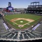 Workers prepare Coors Field on Wednesday, March 31, 2021, in Denver, the day before the Colorado Rockies&#39; season-opener against the Los Angeles Dodgers. (AP Photo/David Zalubowski) **FILE**