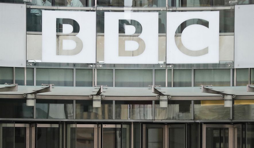 This file photo dated Wednesday, July 19, 2017, shows the BBC sign outside the entrance to the headquarters of the publicly funded media organization in London. (AP Photo/Frank Augstein, FILE)