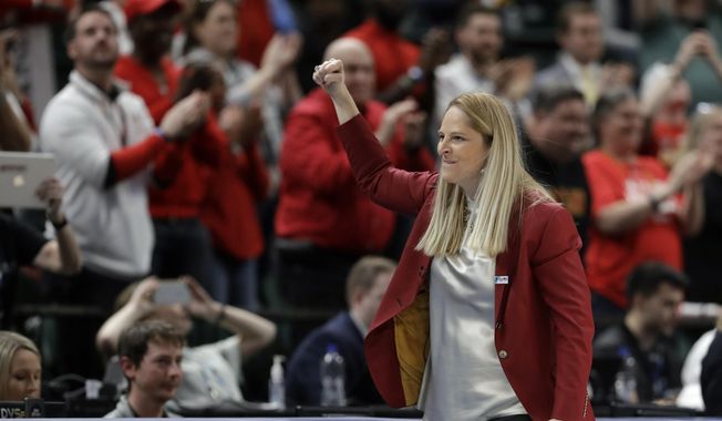 Maryland head coach Brenda Frese reacts after Maryland defeated Ohio State to win the NCAA college basketball championship game at the Big Ten Conference tournament in Indianapolis, in this Sunday, March 8, 2020, file photo. Maryland coach Brenda Frese was honored as The Associated Press women&#x27;s basketball coach of the year Wednesday, March 31, 2021, for the second time in her career. (AP Photo/Darron Cummings, File) **FILE**