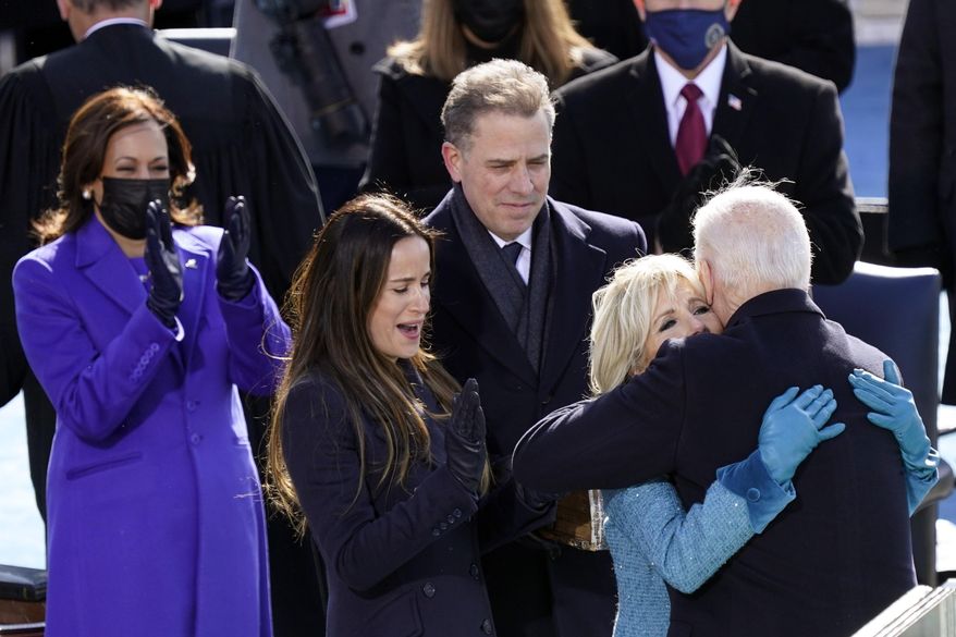 FILE - In this Wednesday, Jan. 20, 2021, file photo, President Joe Biden hugs first lady Jill Biden, as his son Hunter Biden and daughter Ashley Biden look on after the president was sworn-in during the 59th presidential inauguration at the U.S. Capitol in Washington. Vice President Kamala Harris applauds, at left. Hunter Biden says his service on the board of a Ukrainian gas company wasn&#39;t unethical and didn&#39;t amount to a lack of judgment on his part. But he writes in a new book, “Beautiful Things,” that he wouldn&#39;t do it again, citing partisan politics as the reason. (AP Photo/Carolyn Kaster, File)