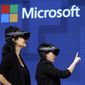 In this May 11, 2017, file photo, members of a design team at Cirque du Soleil demonstrate use of Microsoft&#39;s HoloLens device in helping to virtually design a set at the Microsoft Build 2017 developers conference in Seattle. Microsoft says it has won a nearly $22 billion contract to supply U.S. Army combat troops with its virtual reality headsets. Microsoft announced the deal Wednesday, March 31, 2021. (AP Photo/Elaine Thompson, File)