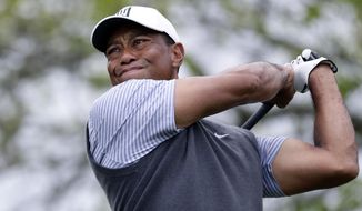In this March 29, 2019, file photo Tiger Woods watches his drive on the sixth hole during round-robin play at the Dell Technologies Match Play Championship golf tournament, in Austin, Texas. (AP Photo/Eric Gay, File)