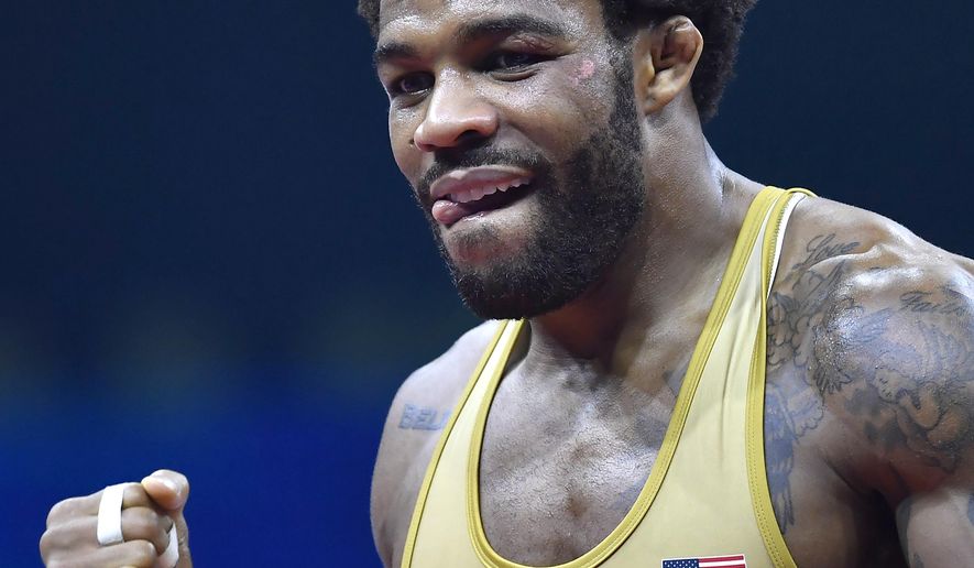 FILE - Jordan Burroughs reacts after defeating Frank Chamizo Marquez, of Italy, in the bronze medal match at the Wrestling World Championships in Budapest, Hungary, in this Sunday, Oct. 21, 2018, file photo. The spotlight is on Jordan Burroughs and Kyle Dake heading into the U.S. Olympic wrestling trials. (Tibor Illyes/MTI via AP, File)
