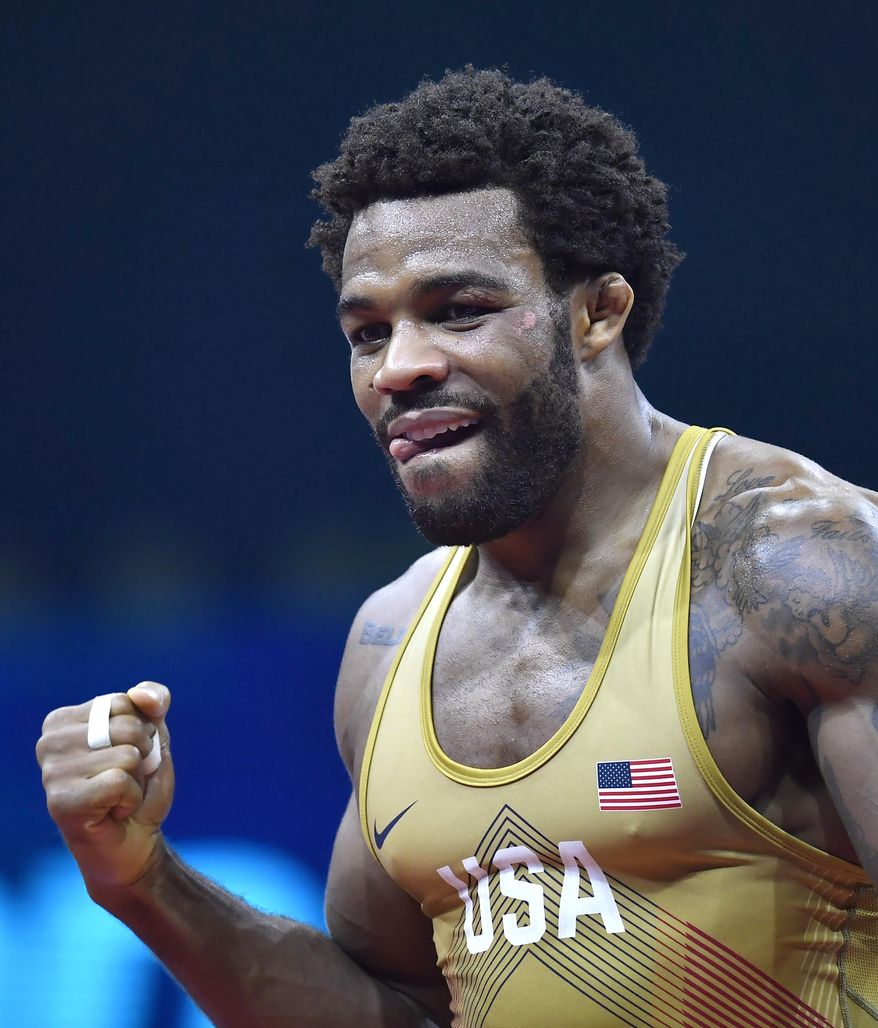 FILE - Jordan Burroughs reacts after defeating Frank Chamizo Marquez, of Italy, in the bronze medal match at the Wrestling World Championships in Budapest, Hungary, in this Sunday, Oct. 21, 2018, file photo. The spotlight is on Jordan Burroughs and Kyle Dake heading into the U.S. Olympic wrestling trials. (Tibor Illyes/MTI via AP, File)
