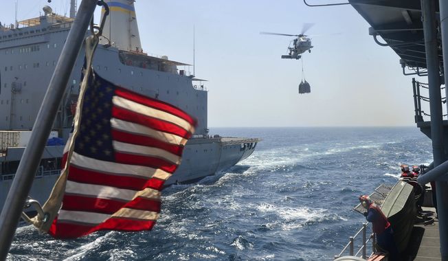 In this file photo, an SH-60B Sea Hawk helicopter assigned to the Vipers of Helicopter Anti-Submarine Squadron Light (HSL) 48, carries pallets of supplies to the flight deck of the guided-missile cruiser USS Monterey. The Monterey, along with the USS Thomas Hudner, participated last month in Sea Shield 2021, a multinational Black Sea naval exercise hosted by Romania. (U.S. Navy photo) **FILE**