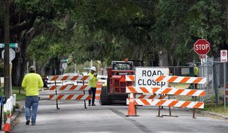 A city street is seen closed for repairs and upgrades,Thursday, April 1, 2021, in Orlando, Fla. As part of an infrastructure proposal by the Biden administration, $115 billion is earmarked to modernize the bridges, highways and roads that are in the worst shape. (AP Photo/John Raoux)