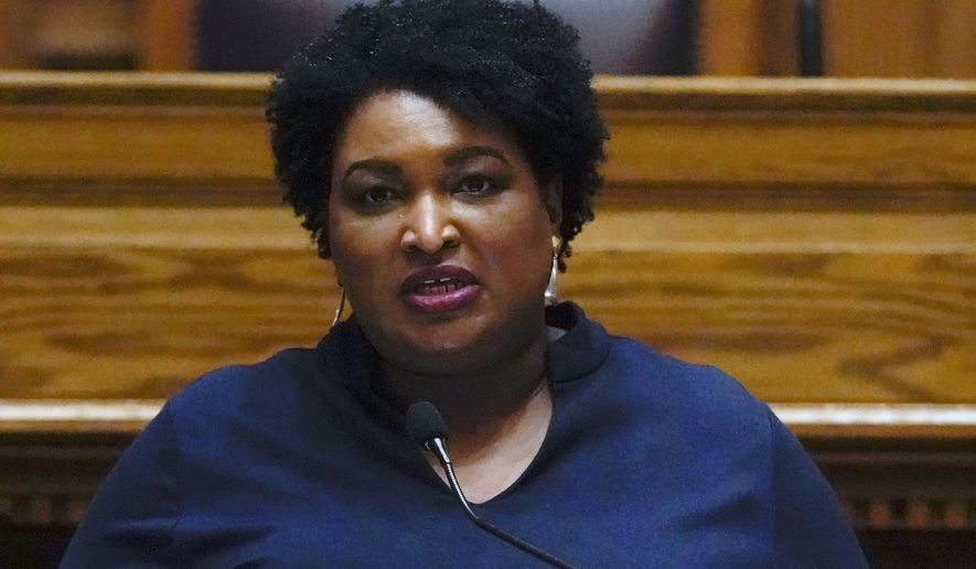 Democrat Stacey Abrams speaks before members of Georgia&#39;s Electoral College cast their votes at the state Capitol, in Atlanta, Dec. 14, 2020. A wide-ranging lawsuit filed in November 2018 to challenge the way Georgia’s elections are run has been pared down by a federal judge. The lawsuit was filed in November 2018 by Fair Fight Action, a group founded by Abrams, who narrowly lost the governor&#39;s race that month. Abrams ran against then-Secretary of State Brian Kemp, who has denied any wrongdoing. (AP Photo/John Bazemore, Pool) ** FILE **