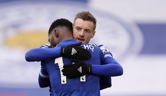 Leicester&#x27;s Kelechi Iheanacho celebrates with Jamie Vardy, right, after scoring the opening goal during the English Premier League soccer match between Leicester City and Sheffield United at the King Power Stadium in Leicester, England, Sunday, March 14, 2021. (Alex Pantling/Pool via AP)