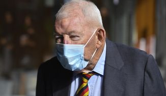 Ron Brierley leaves the Downing Centre District Court in Sydney, Thursday, April 1, 2021. Brierley, one of New Zealand&#39;s most well-known businessmen, pleaded guilty Thursday to possessing child sex abuse images, including some of children as young as 2. (Mick Tsikas/AAP Image via AP)
