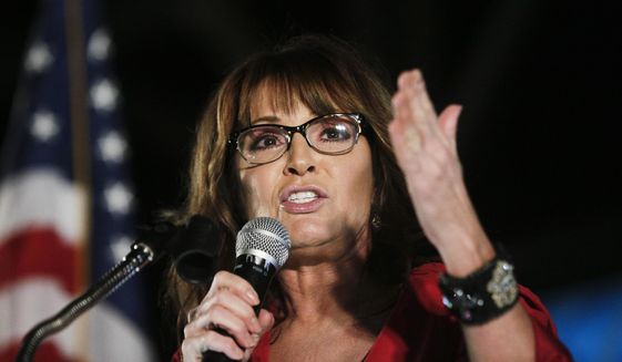 In this Sept. 21, 2017, file photo, former vice presidential candidate Sarah Palin speaks at a rally in Montgomery, Ala. Palin says she tested positive for COVID-19 and is urging people to take steps to guard against the coronavirus, including wearing masks in public. (AP Photo/Brynn Anderson, File)