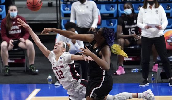 South Carolina forward Aliyah Boston, right, blocks a shot by Stanford guard Lexie Hull (12) during the first half of a women&#39;s Final Four NCAA college basketball tournament semifinal game Friday, April 2, 2021, at the Alamodome in San Antonio. (AP Photo/Eric Gay)