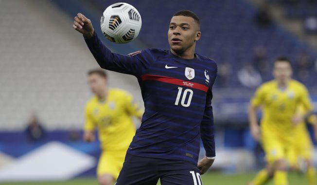 France&#x27;s Kylian Mbappe controls the ball during the World Cup 2022 group D qualifying soccer match between France and Ukraine at the Start de de France stadium, in Saint Denis, north of Paris, Wednesday, March 24, 2021. (AP Photo/Thibault Camus)