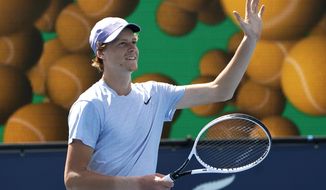 Jannik Sinner, of Italy, waves after defeating Roberto Bautista Agut, of Spain, during the semifinals of the Miami Open tennis tournament, Friday, April 2, 2021, in Miami Gardens, Fla. Sinner won 5-7, 6-4, 6-4. (AP Photo/Lynne Sladky)