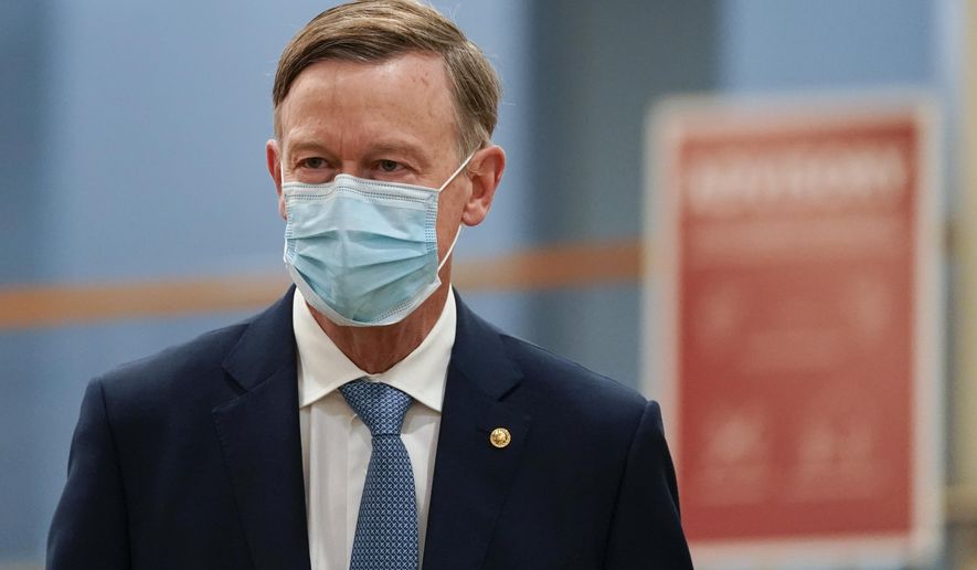 Sen. John Hickenlooper, D-Colo., arrives on Capitol Hill in Washington, Saturday, Feb. 13, 2021, on the fifth day of the second impeachment trial of former President Donald Trump. (AP Photo/Alex Brandon)