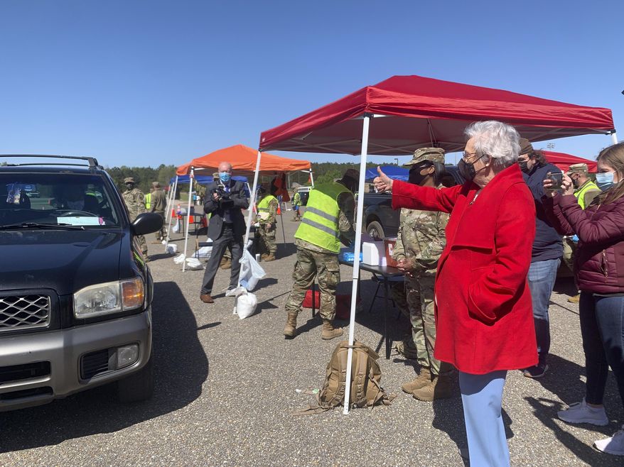 Alabama Gov. Kay Ivey gives a thumbs up to people in line to get COVID-19 vaccinations at an Alabama National Guard clinic in Camden, Ala., on Friday, April 2, 2021. (AP Photo/Kim Chandler) ** FILE **