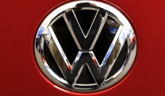 FILE - This Feb. 14, 2019, file photo, shows the Volkswagen logo on an automobile at the 2019 Pittsburgh International Auto Show in Pittsburgh.   The U.S. government’s road safety agency has opened two investigations into problems with Volkswagen vehicles, including one that alleges serious gasoline leaks under the hood. Details of the probes covering nearly 215,000 vehicles were posted Friday, April 2, 2021, on the National Highway Traffic Safety Administration website.  (AP Photo/Gene J. Puskar, File)
