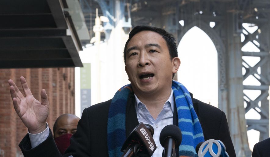FILE - In this March 11, 2021 file photo, Democratic mayoral candidate Andrew Yang holds a news conference in the Dumbo neighborhood of New York.  Yang has resumed campaigning a day after going to the hospital for a kidney stone. Yang’s campaign said Saturday, April 3,  that he planned to visit an Easter egg hunt at the Queens County Farm and meet with campaign volunteers at Open Streets locations in Brooklyn.  (AP Photo/Mark Lennihan, File)