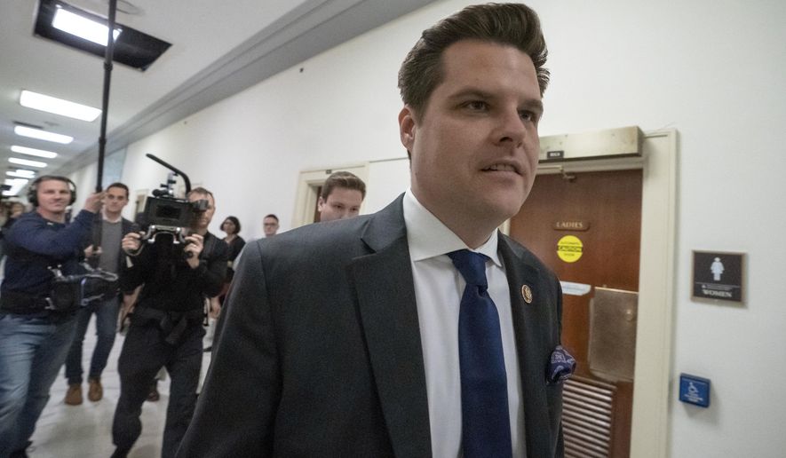 In a Feb. 27, 2019 file photo, Rep. Matt Gaetz, R-Fla., a member of the House Judiciary Committee, walks past the House Oversight hearing with Michael Cohen, President Donald Trump&#39;s former personal lawyer, on Capitol Hill in Washington. (AP Photo/J. Scott Applewhite, File)
