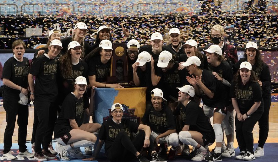 Stanford players celebrate with the trophy after the championship game against Arizona in the women&#39;s Final Four NCAA college basketball tournament, Sunday, April 4, 2021, at the Alamodome in San Antonio. Stanford won 54-53. (AP Photo/Morry Gash) **FILE**