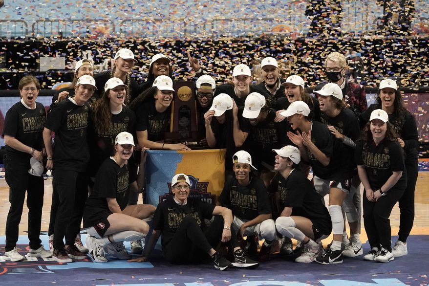 Stanford players celebrate with the trophy after the championship game against Arizona in the women&#39;s Final Four NCAA college basketball tournament, Sunday, April 4, 2021, at the Alamodome in San Antonio. Stanford won 54-53. (AP Photo/Morry Gash) **FILE**