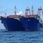 China is targeting regional U.S. allies in Asia with an escalating number of military flights around Taiwan and massing more than 200 fishing ships near a disputed reef. (Associated Press)
