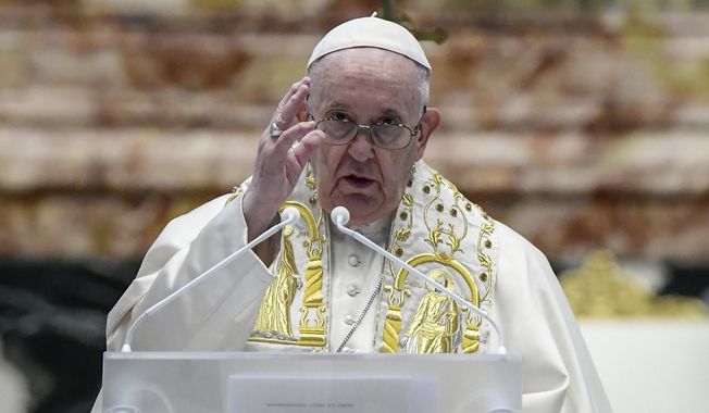 Pope Francis delivers his Urbi et Orbi blessing after celebrating Easter Mass at St. Peter's Basilica at The Vatican Sunday, April 4, 2021, during the Covid-19 coronavirus pandemic. (Filippo Monteforte/Pool photo via AP)
