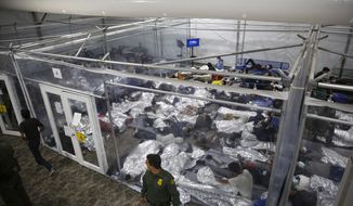 Minors reside inside a pod at the Donna Department of Homeland Security holding facility, the main detention center for unaccompanied children in the Rio Grande Valley run by U.S. Customs and Border Protection (CBP), in Donna, Texas, March 30, 2021. More Americans disapprove than approve  of how President Joe Biden is handling waves of unaccompanied immigrant children arriving at the U.S.-Mexico border, and his efforts on larger immigration policy aren’t polling as well as those on other top issues. (AP Photo/Dario Lopez-Mills, Pool)  ** FILE **