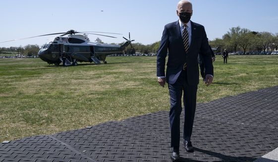 President Joe Biden walks over to speak with reporters on the Ellipse on the National Mall after spending the weekend at Camp David, Monday, April 5, 2021, in Washington. (AP Photo/Evan Vucci)