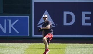 Washington Nationals starting pitcher Max Scherzer throws during a baseball workout at Nationals Park, Monday, April 5, 2021, in Washington. The Nationals are scheduled to play the Braves on Tuesday. (AP Photo/Alex Brandon)
