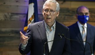Senate Minority Leader Mitch McConnell, R-Ky., speaks during a news conference at Kroger Field in Lexington, Ky., Monday, April 5, 2021. (AP Photo/Timothy D. Easley)