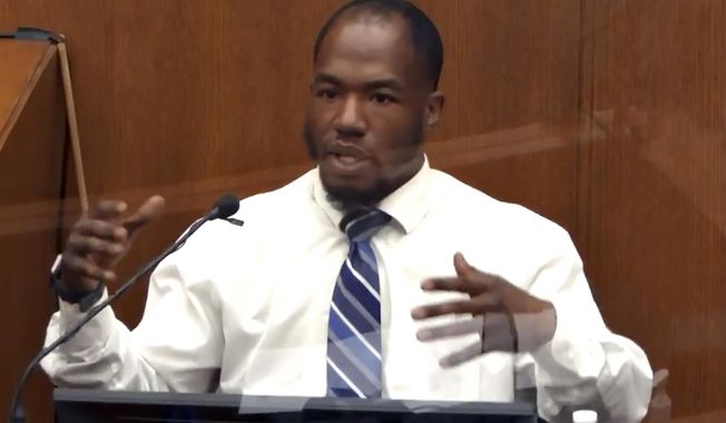 In this image from video, witness Donald Williams answers questions as Hennepin County Judge Peter Cahill presides Monday, March 29, 2021, in the trial of former Minneapolis police officer Derek Chauvin, in the May 25, 2020, death of George Floyd at the Hennepin County Courthouse in Minneapolis, Minn. Williams was testifying about what he saw of Floyd’s arrest. (Court TV via AP, Pool)