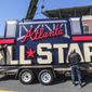 Workers load an All-Star sign onto a trailer after it was removed from Truist Park in Atlanta, Tuesday, April 6, 2021. (John Spink/Atlanta Journal-Constitution via AP) ** FILE **