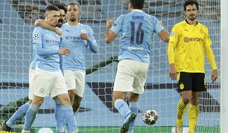 Manchester City&#39;s Phil Foden celebrates after scoring his side&#39;s second goal during the Champions League, first leg, quarterfinal soccer match between Manchester City and Borussia Dortmund at the Etihad stadium in Manchester, Tuesday, April 6, 2021. (AP Photo/Dave Thompson)