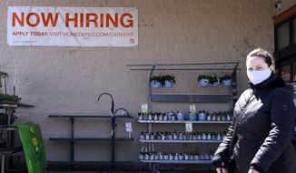 A hiring sign is seen outside home improvement store in Mount Prospect, Ill., Friday, April 2, 2021.  The pace of job openings reached the highest level on record in February, a harbinger of healthy hiring and a hopeful sign for those looking for work.  (AP Photo/Nam Y. Huh)