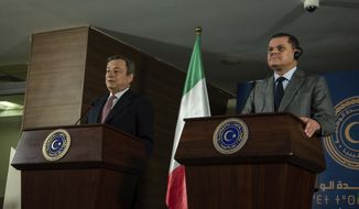 Abdul Hamid Dbeibeh, the Prime Minister of the Government of National Unity, right, and Mario Draghi, the Prime Minister of Italy, speak to media, Tuesday, April, 6 2021 in Tripoli, Libya. (AP Photo/Nada Harib)